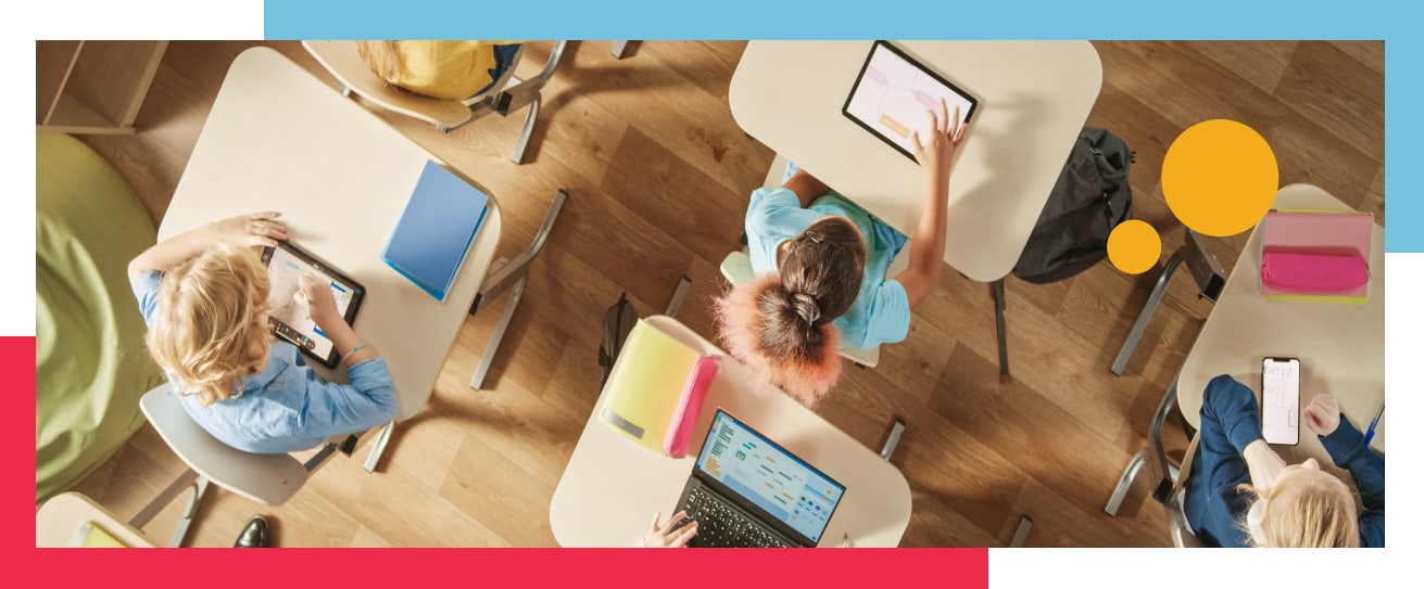 School professional on laptop supporting student.