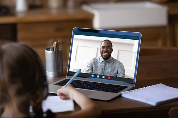 School Teacher working with students in a virtual classroom
