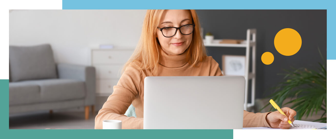 School professional on laptop supporting student.
