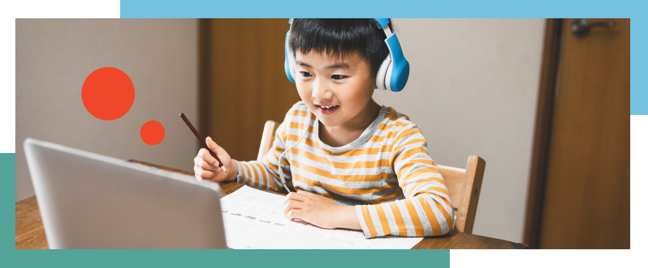 School professional on laptop supporting student.